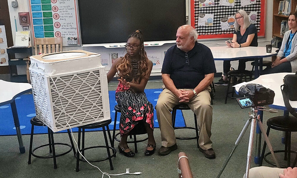 Eniola Shokunbi explaining how her classroom air filter works